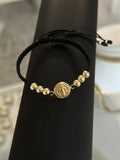 Pulsera tejida san Benito mediano 10mm. N° de Balín: #6 liso